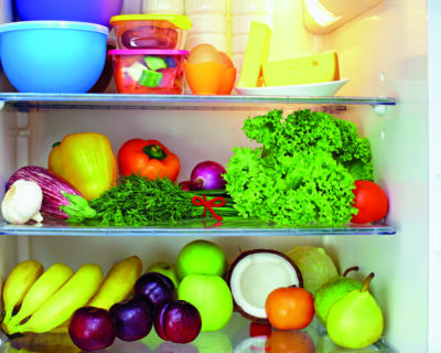 refrigerator full of healthy food. fruits and vegetables