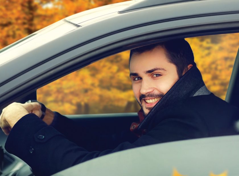 man driving car