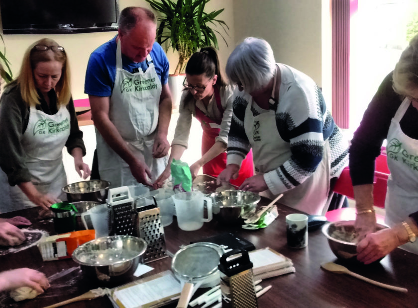 people cooking together in kitchen
