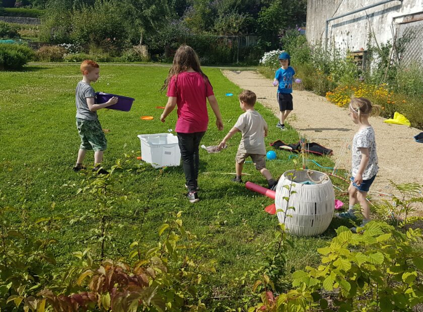 community climate action - kids playing on the grass