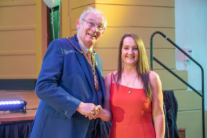 Janet collecting her award from Jim Leishman for Inspirational Volunteer at the FVA awards.